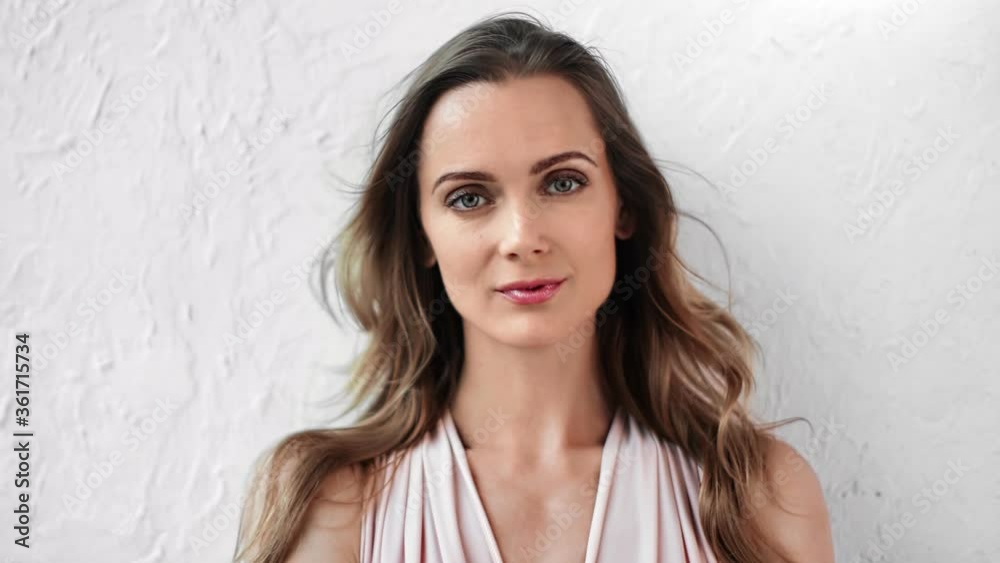 Portrait of tender female in feminine clothes posing isolated. Medium close up shot on 4k RED camera Portrait of tender female in feminine clothes posing isolated. Medium close up shot on 4k RED camera