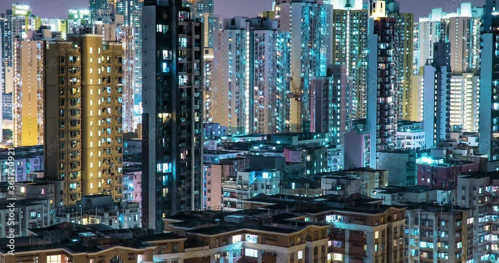Crowded City With Lights Turning On And Off at Midnight. Night-Scape Urban Metropolis Time Lapse. Exterior of residential building public housing apartment block at night Crowded City With Lights Turning On And Off at Midnight. Night-Scape Urban Metropolis Time Lapse. Exterior of residential building public housing apartment block at night