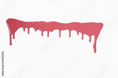 Pink thick paint spreads on a white background, stains paint brush texture