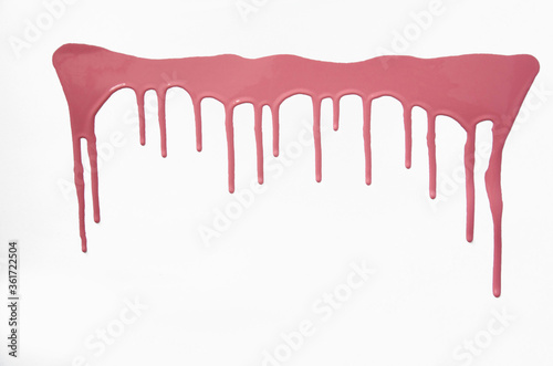 Pink thick paint spreads on a white background, stains paint brush texture