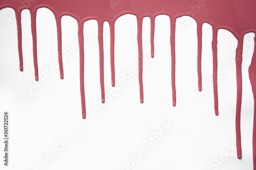 Pink thick paint spreads on a white background, stains paint brush texture