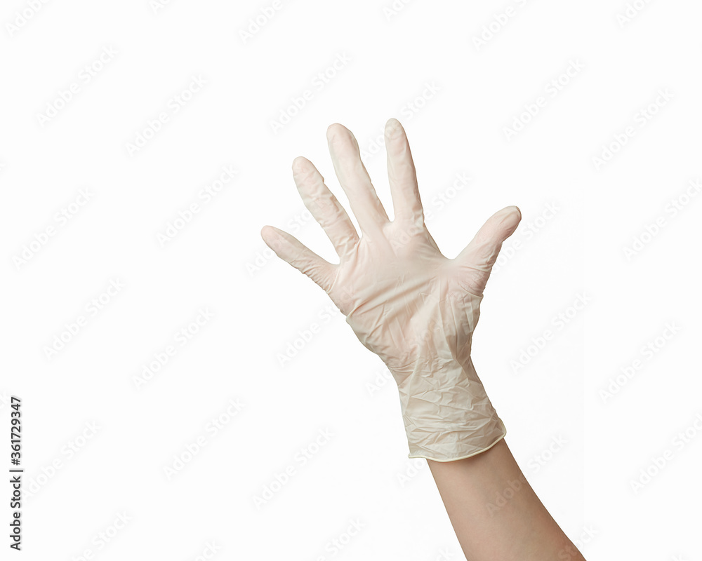 hand of a girl in a white rubber glove on a white background hand of a girl in a white rubber glove on a white background