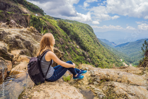 Woman hiker on a rock. View of the valley from the cliff, Vietnam, Da Lat
