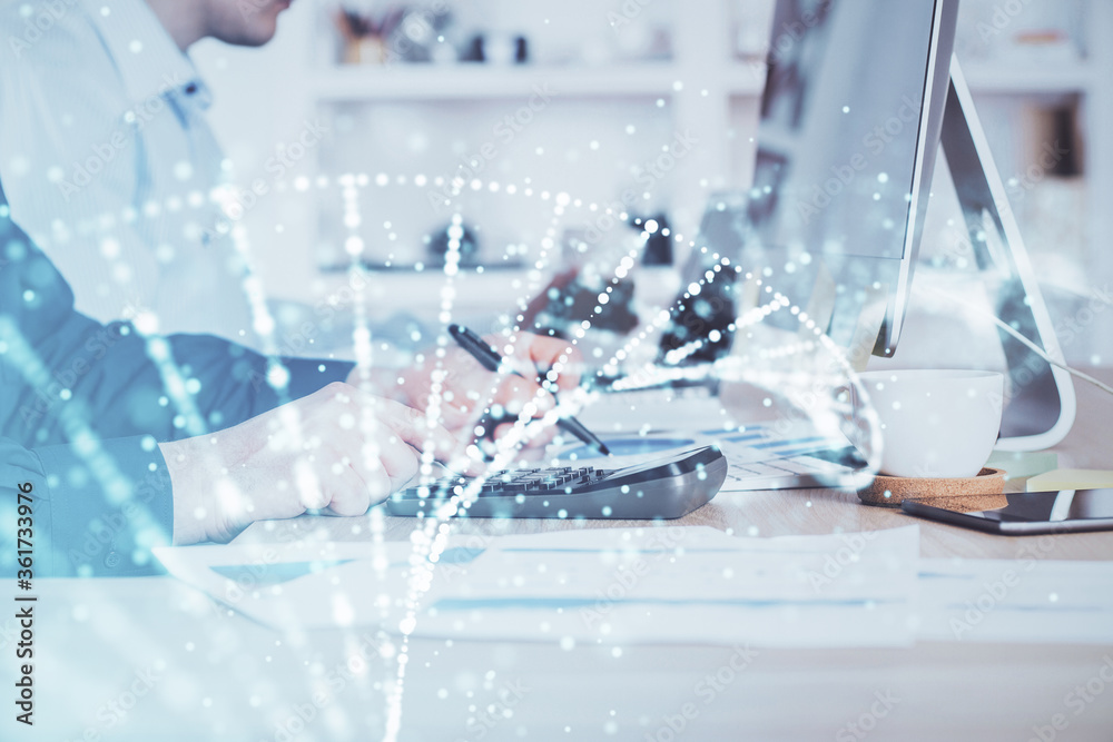 DNA hologram with businessman working on computer on background. Concept of bioengineering. Double exposure. DNA hologram with businessman working on computer on background. Concept of bioengineering. Double exposure.