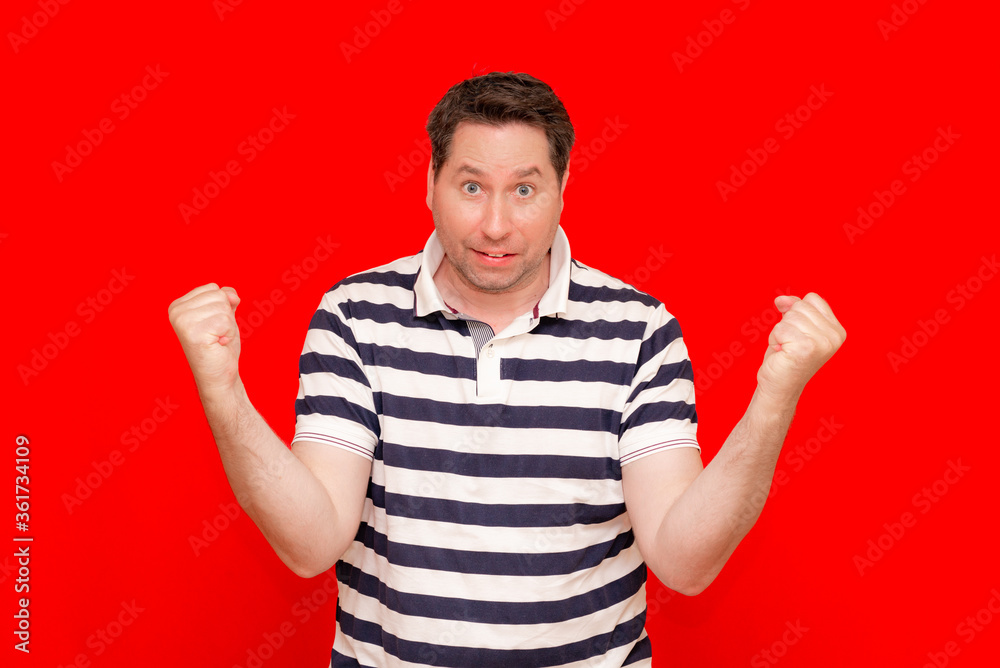 portrait of happy man rise up hands fists and successful achievement of goals portrait of happy man rise up hands fists and successful achievement of goals