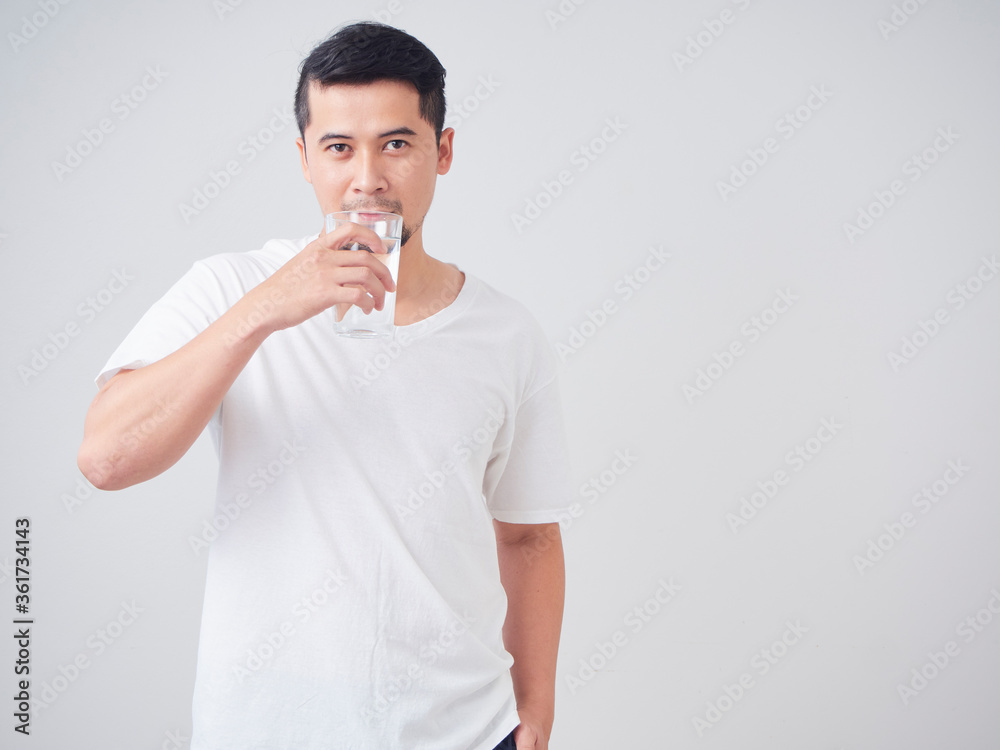Young man with glass of water. Young man with glass of water.