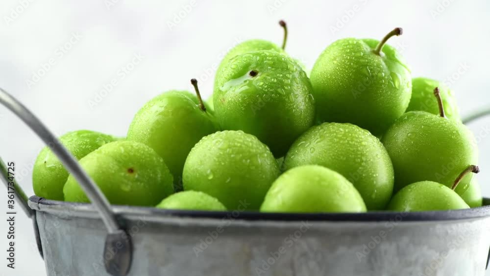 Ripe fresh juicy fruits of green plum. Harvested for storage and preparation. Close-up. 4K UHD video 3840x2160 Ripe fresh juicy fruits of green plum. Harvested for storage and preparation. Close-up. 4K UHD video 3840x2160