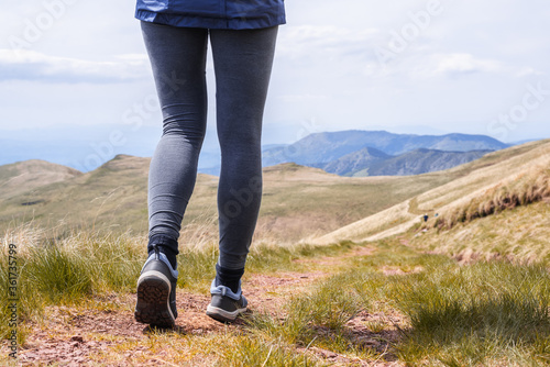 Woman hiking in nature in mountain.