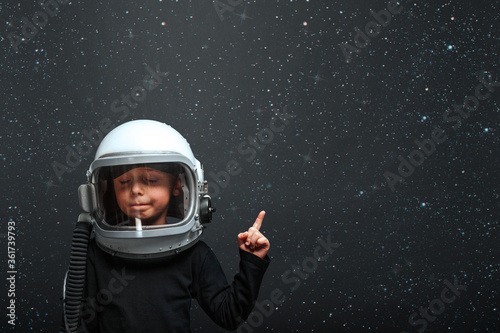 child wants to fly an airplane wearing an airplane helmet © vovan