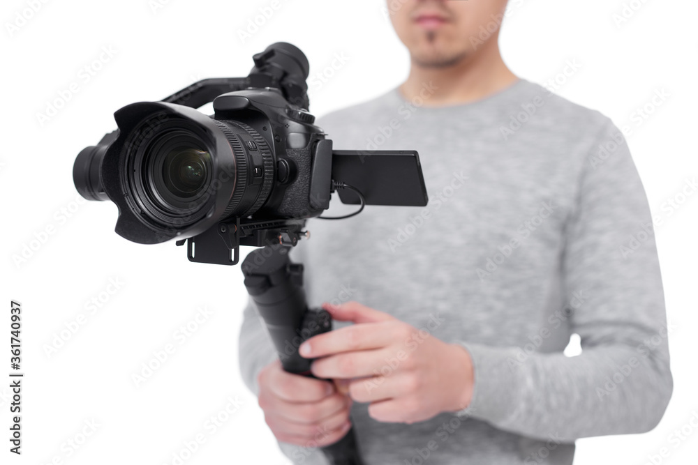close up of modern dslr camera on 3-axis gimbal stabilizer in videographer hands isolated on white