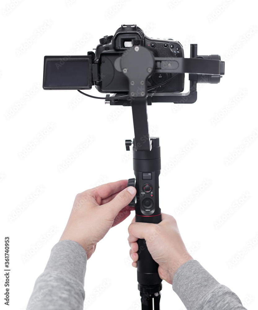 modern dslr camera on 3-axis gimbal stabilizer in male videographer hands isolated on white modern dslr camera on 3-axis gimbal stabilizer in male videographer hands isolated on white