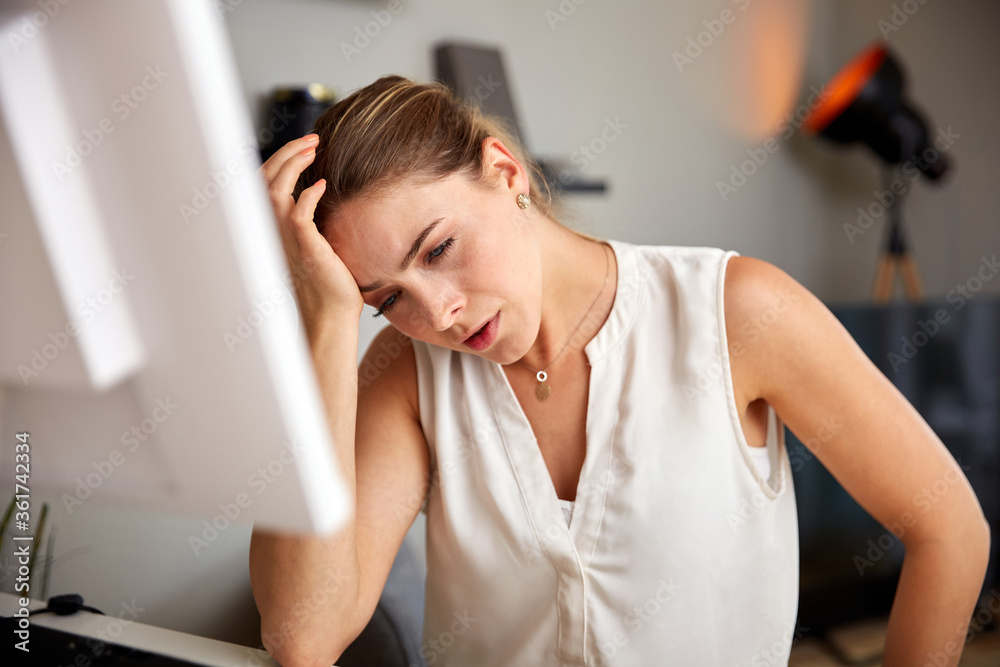 Fototapeta premium Attractive Young Female Freelancer Suffering From Headache