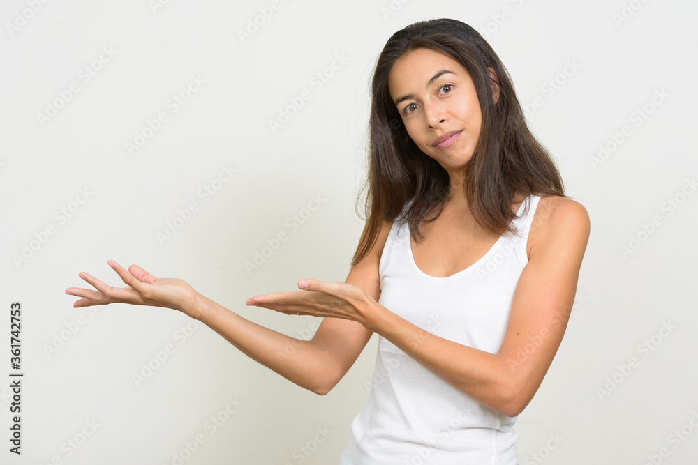 Portrait of beautiful multi ethnic woman showing something Portrait of beautiful multi ethnic woman showing something