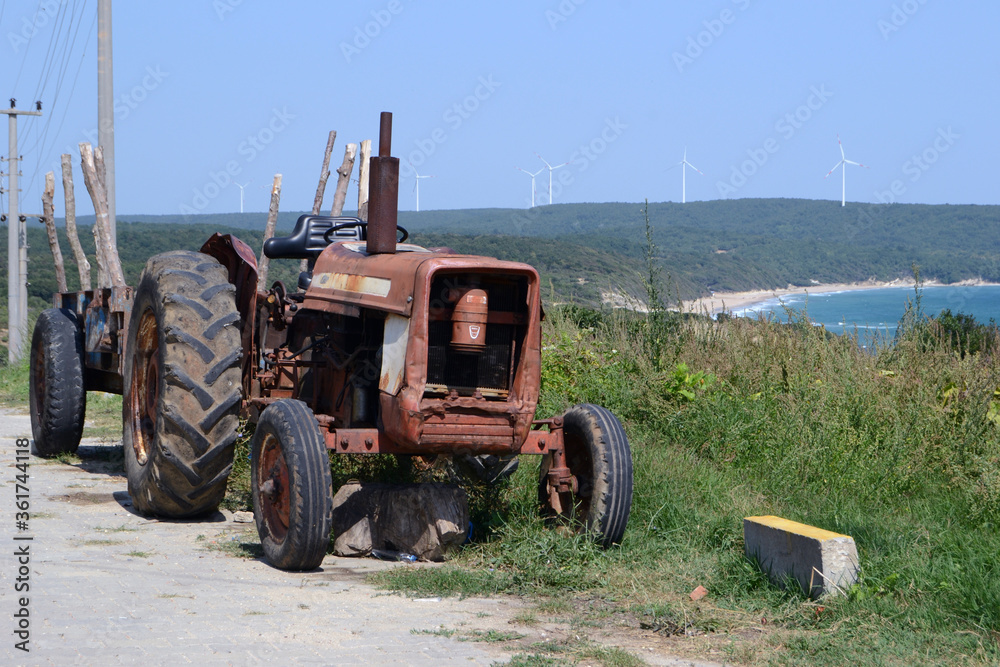 An old tractor that has completed its working life and has been abandoned.