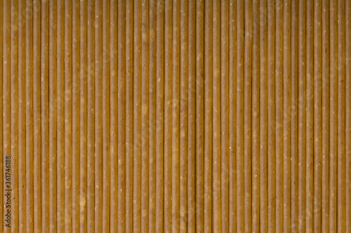 Raw rye spaghetti texture background. Close up