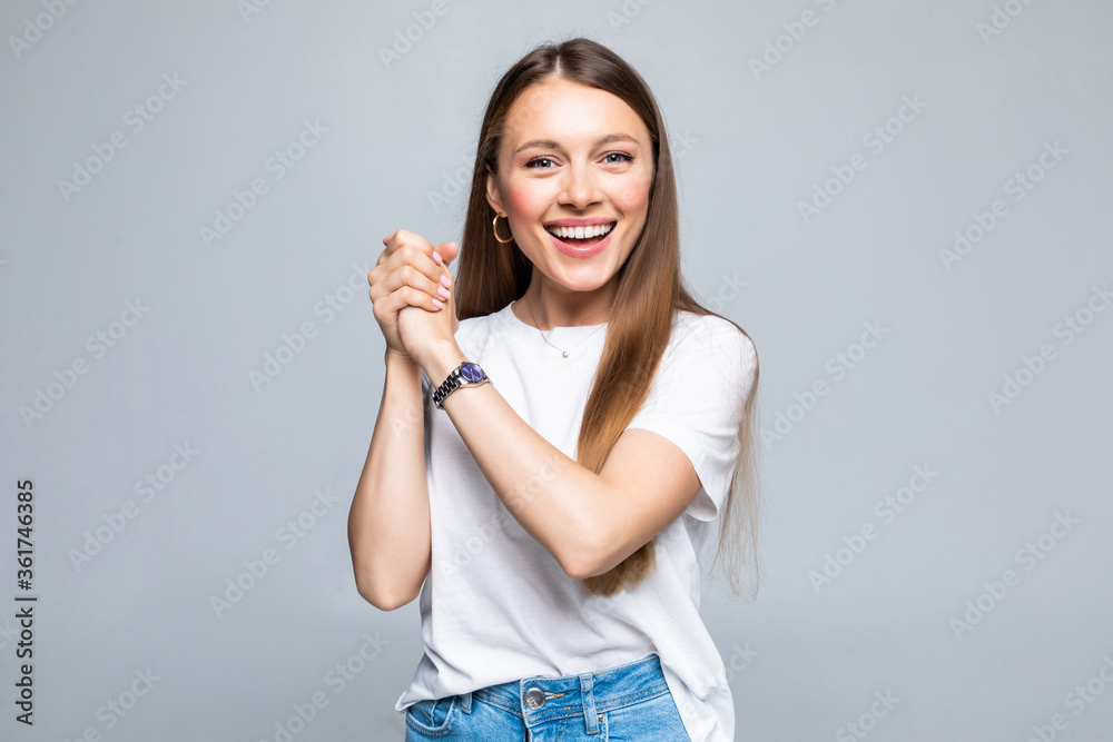 Young beautiful brunette woman clapping hands together over isolated white background Young beautiful brunette woman clapping hands together over isolated white background