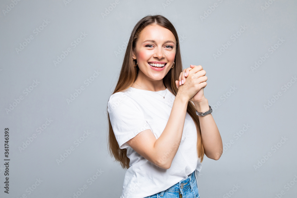 Young beautiful brunette woman clapping hands together over isolated white background Young beautiful brunette woman clapping hands together over isolated white background