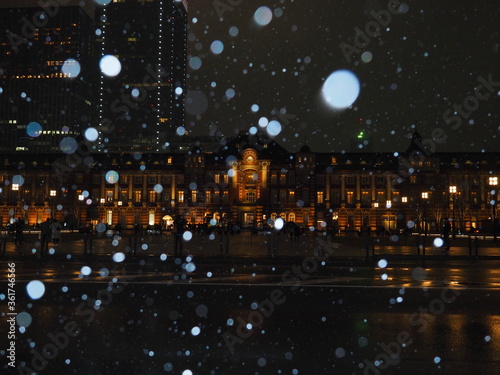 Tokyo station building in snowflakes reflection