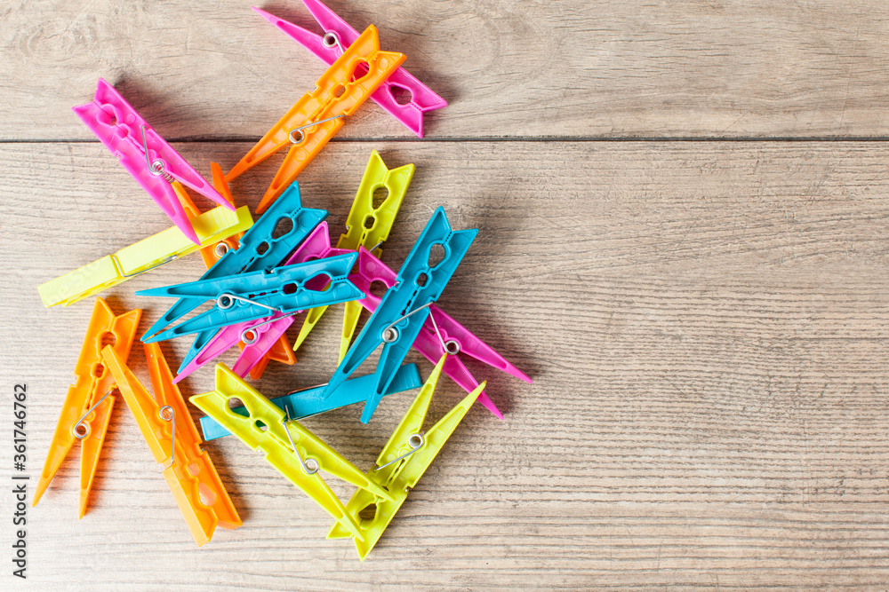 clothes pegs isolated on wooden  background