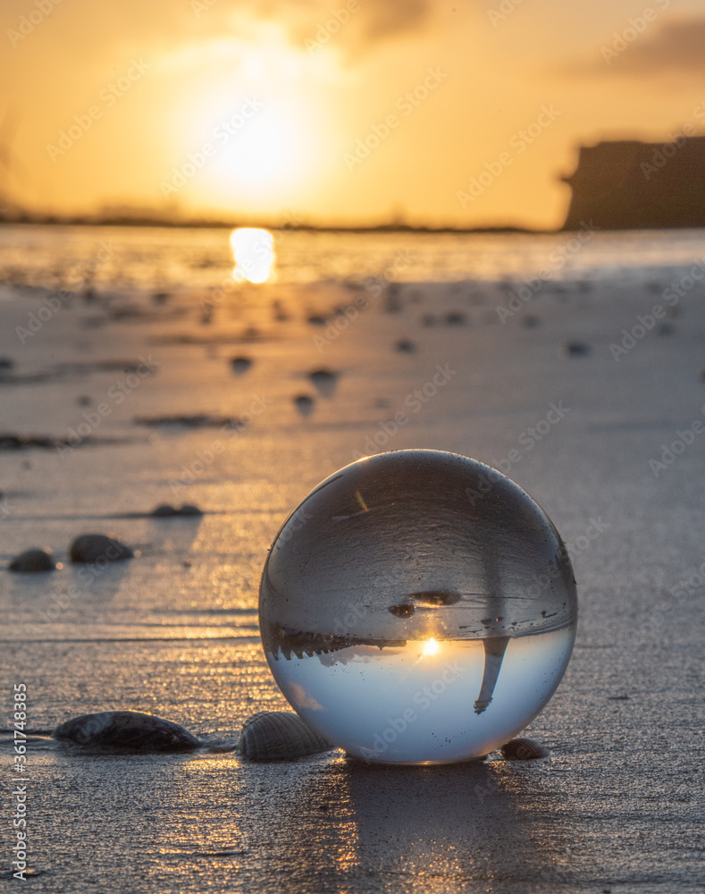 glass ball on the beach glass ball on the beach