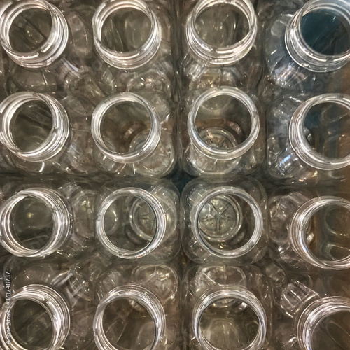 empty plastic bottles for drinks in packaging, top view, on production in Warsaw catering