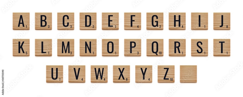 Alphabet letters on wooden pieces, classic board game. - obrazy, fototapety, plakaty 