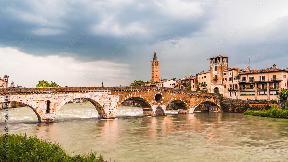 View of Ponte di Pietra bridgeover Adige river.Famous Verona landmark.  Verona, Italy