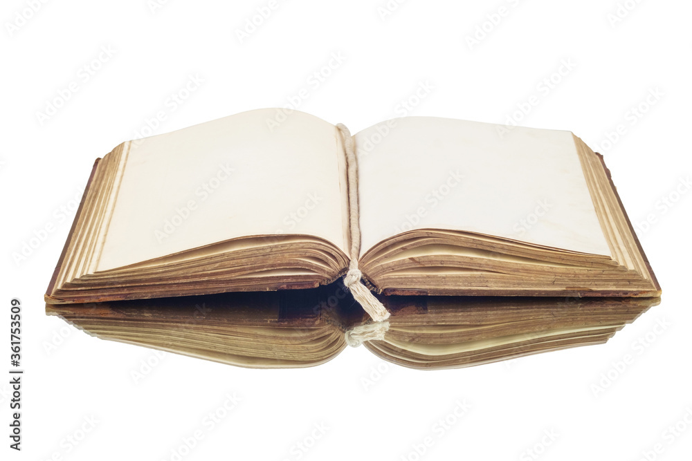 Fototapeta premium An old vintage open book reflecting on a white surface