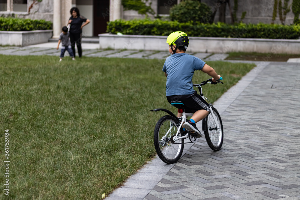 little boy riding a bike