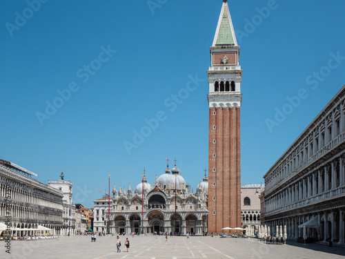 Venice, Italy - July 2020 Saint Marcus Square, the cathedral, tower and Doge s Palace durig summer time. photo