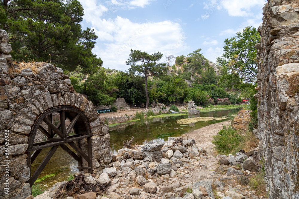 Ruins of the ancient city of Olympos in Cirali village in Antalya, Turkey.  Local and foreign tourists come to visit the ancient city and swim.
