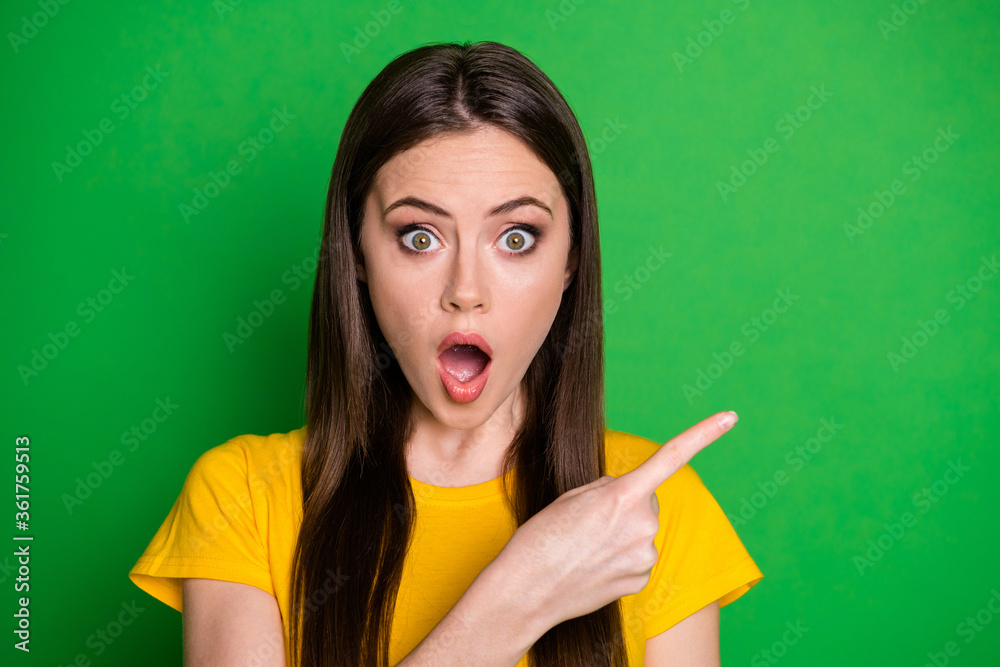 Portrait of astonished girl impressed unbelievable unexpected discount information point index finger copyspace wear good look clothes isolated over vibrant color background Portrait of astonished girl impressed unbelievable unexpected discount information point index finger copyspace wear good look clothes isolated over vibrant color background