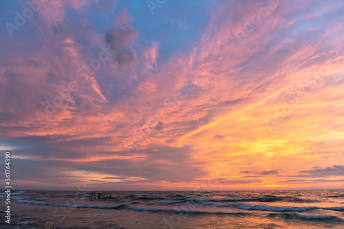 Fototapeta Naklejka Na Ścianę i Meble -  bright picturesque sunset by the sea