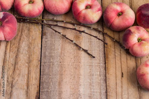 Rustic flat donut peach background on rough wooden plank background with copy space photo
