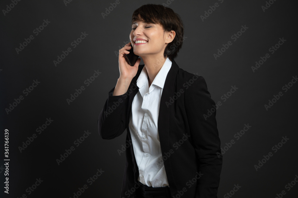 a woman wearing a cotton jacket isolated on a gray background a woman wearing a cotton jacket isolated on a gray background