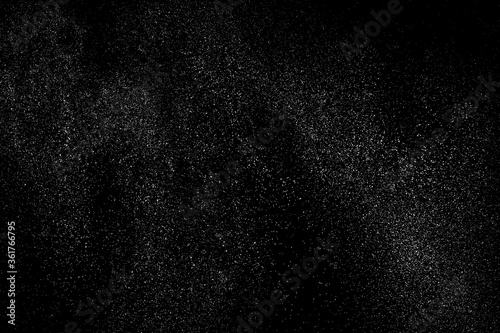 Distressed white grainy texture. Dust overlay textured. Grain noise particles. Snow effects pack. Rusted black background. Vector illustration, EPS 10.  
