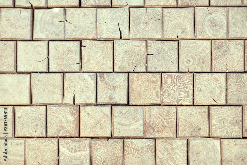 Obraz premium Wooden brick wall. Natural wood texture of square shape. Mosaic of bars. Vintage, abstract pattern. Old retro floor. Dark surface of squares. Rustic style.