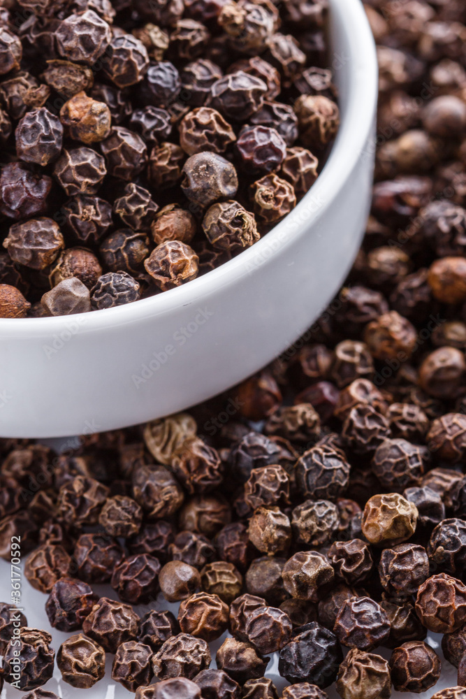fragrant black pepper on white acrylic background fragrant black pepper on white acrylic background