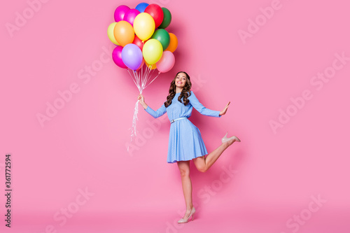 Full length body size view of her she nice attractive pretty cheerful wavy-haired lady holding in hand bunch air balls having fun jubilee posing good mood isolated pink pastel color background