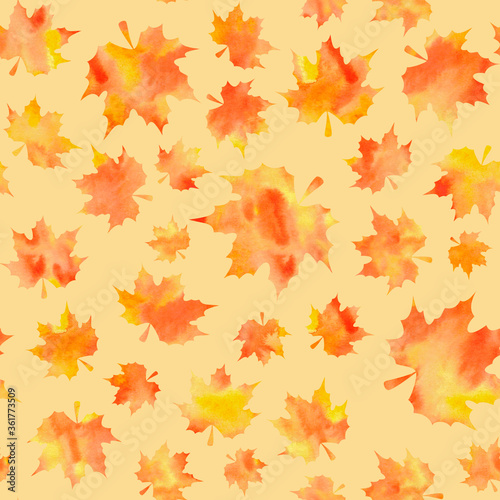 Watercolor orange maple leaves on yellow background. Seamless pattern. Hand-painted texture. Watercolor stock illustration. Design for backgrounds  wallpapers  textile  covers and packaging.