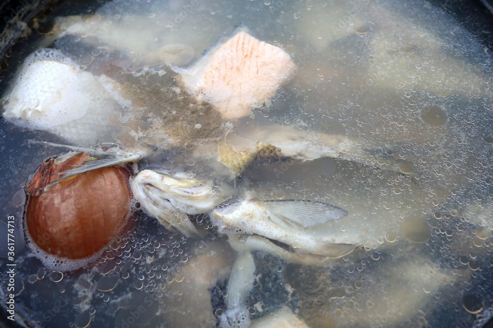 Soup cooked from various fish in cauldron Soup cooked from various fish in cauldron