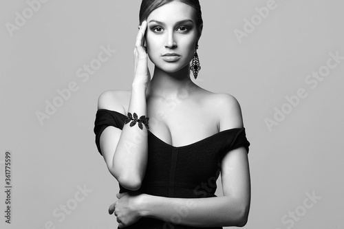 Beautiful sexy woman in jewelry. black and white portrait photo