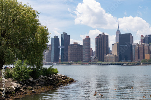 Riverfront of Gantry Plaza State Park in Long Island City Queens New York with a view of the Midtown Manhattan Skyline during Spring
