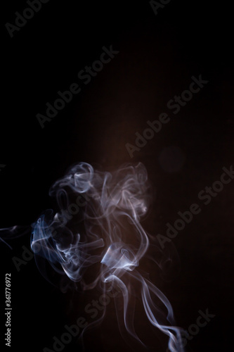 Fototapeta Naklejka Na Ścianę i Meble -  Smoke motion on black background.