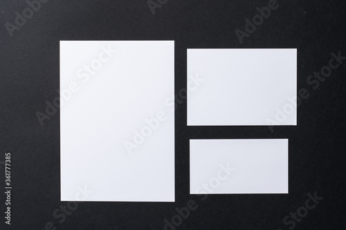 White blank business cards on dark black background