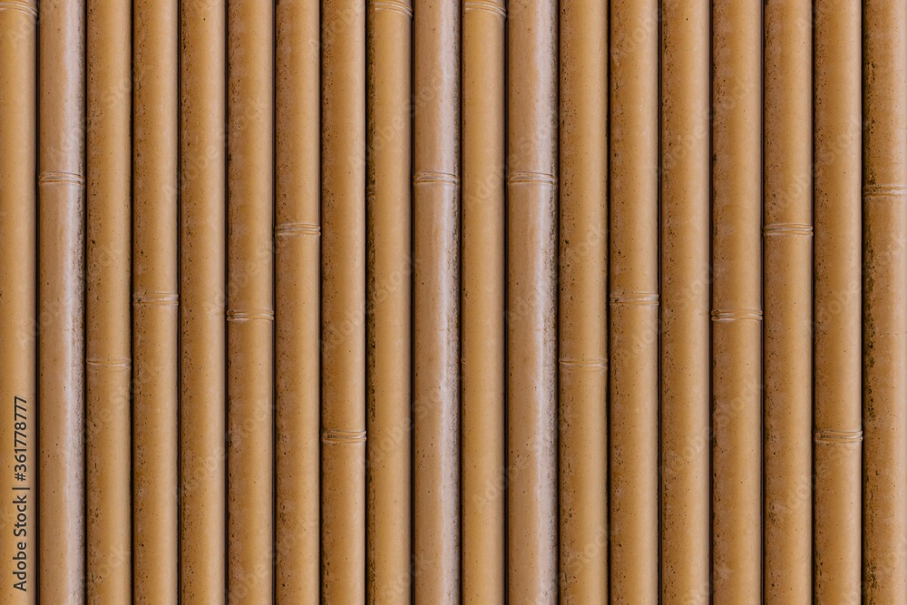 Close - up of Bamboo wall or Bamboo fence texture. Old brown tone natural bamboo fence texture background Close - up of Bamboo wall or Bamboo fence texture. Old brown tone natural bamboo fence texture background
