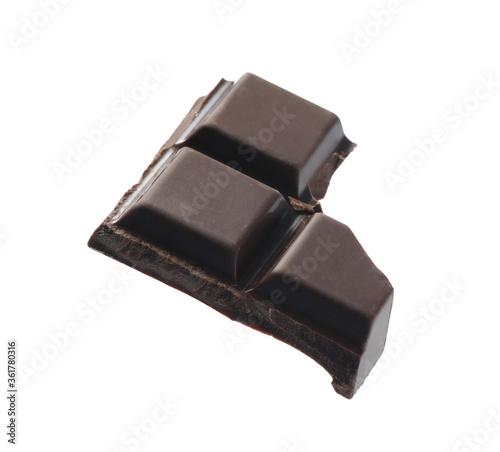 Piece of delicious dark chocolate isolated on white
