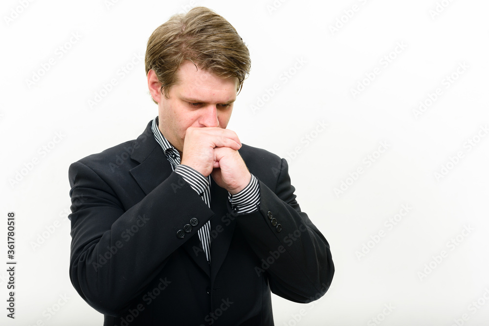 Portrait of stressed young businessman getting bad news Portrait of stressed young businessman getting bad news