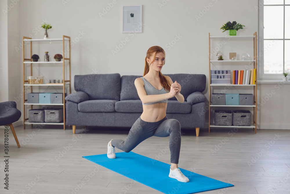 Stay home workout. Sporty girl exercising indoors, doing yoga, pilates or cardio training. Active lifestyle and weight loss Stay home workout. Sporty girl exercising indoors, doing yoga, pilates or cardio training. Active lifestyle and weight loss