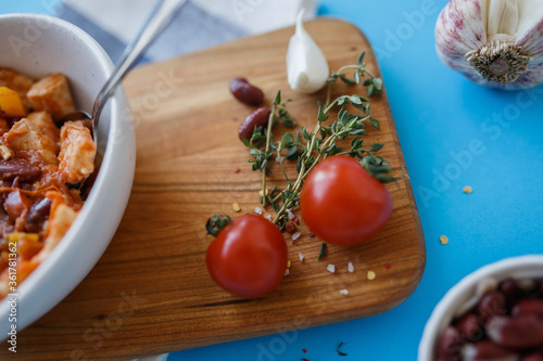 tomatoes and garlic on a wooden board close-up